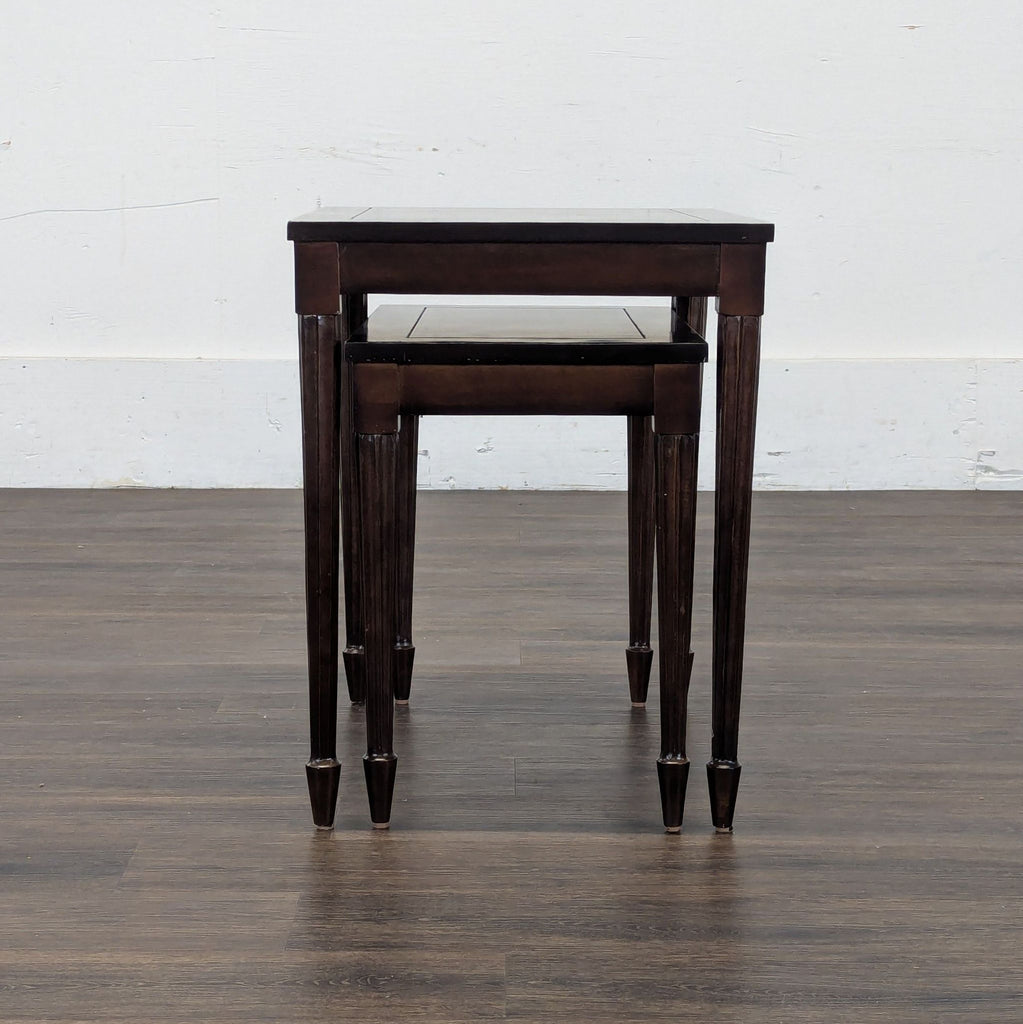 3. Pair of compact, rectangular Reperch nesting tables in a rich wood tone, displayed on wood flooring.