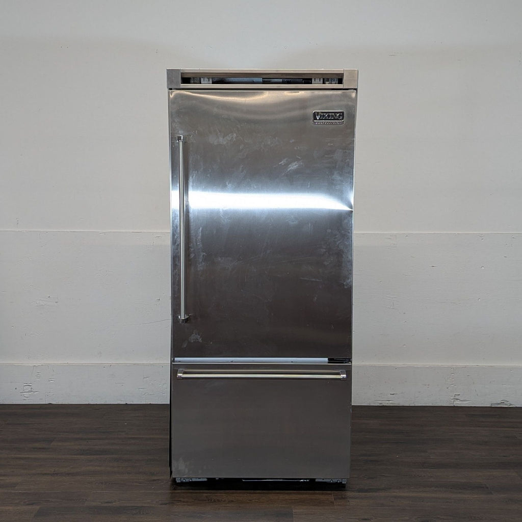 2. Viking Professional refrigerator, stainless steel finish, bottom freezer, shown against a plain white wall.