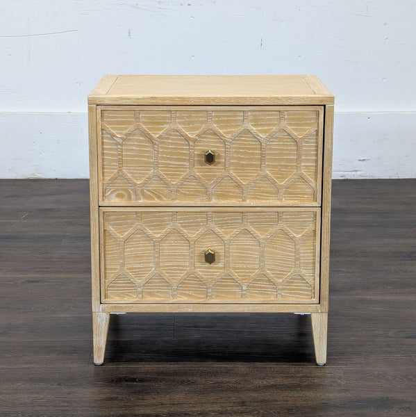 1. Reperch side table with two geometric-patterned drawers and gold knobs in light wood finish, front view.