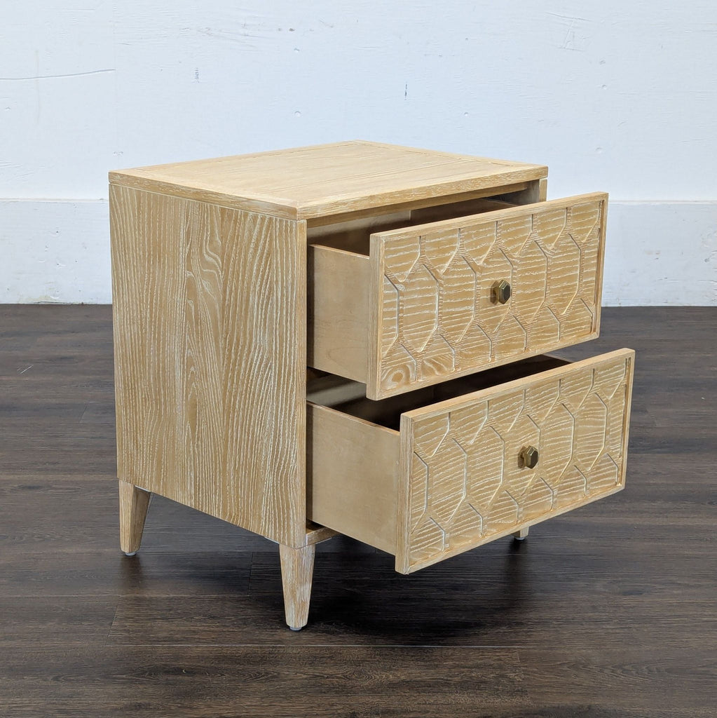 3. Reperch side table with both geometric drawers open, displaying storage space in a light wood finish.