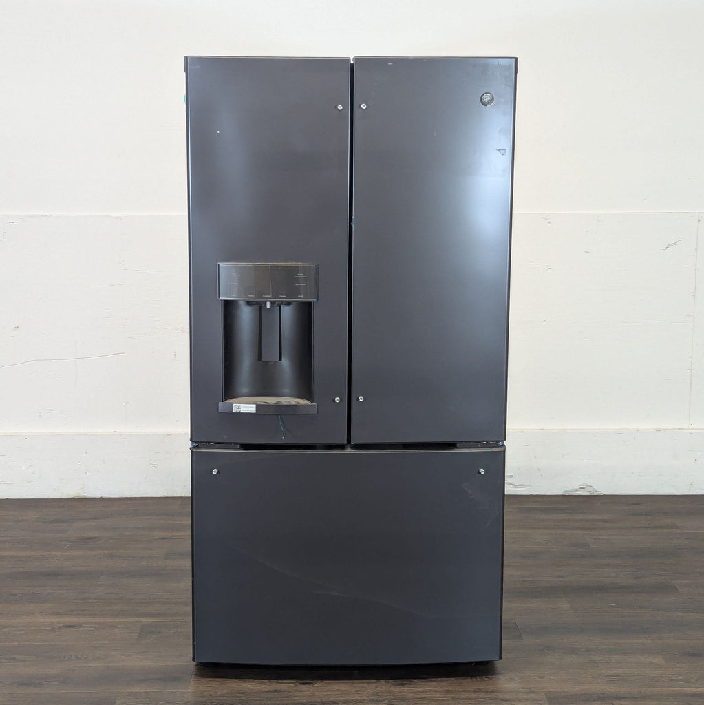 2. Front view of a Reperch refrigerator, featuring French doors and a built-in water and ice dispenser.