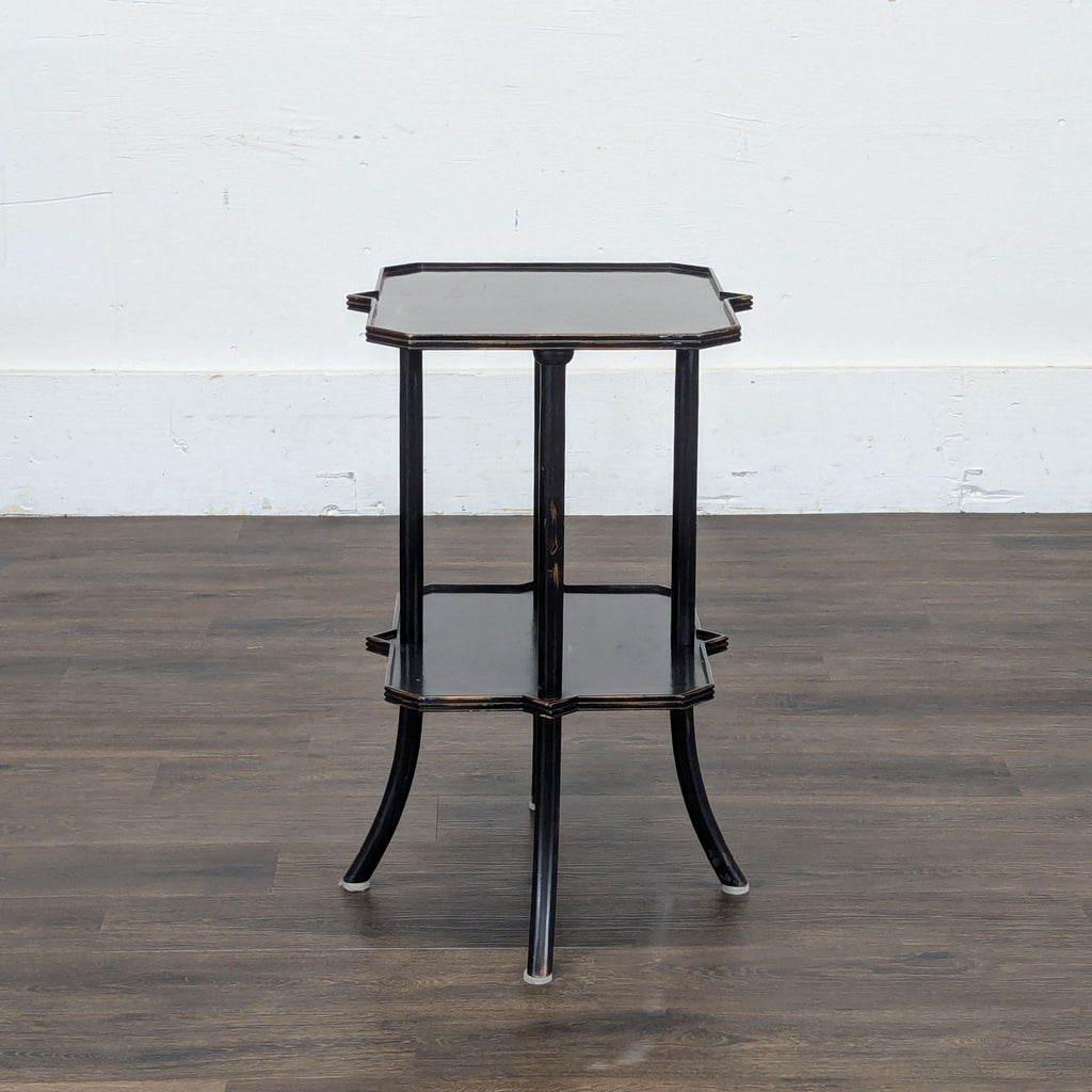 3. Elegant black Reperch accent table with two levels and gently curved legs, suited for side or console use.