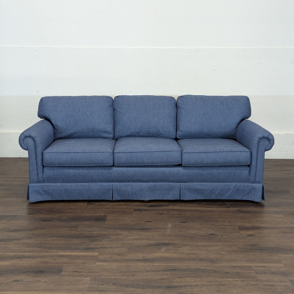 2. Blue Reperch 3-seat sofa with rolled arms, shown on a wooden floor against a plain wall.  