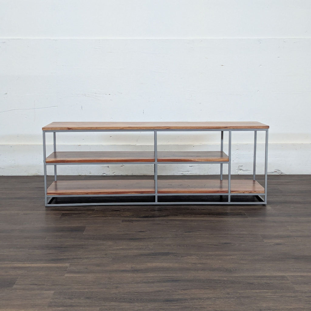 3. Minimalist Reperch Entertainment Center, showing empty wooden shelves and metal frame against a blank wall.