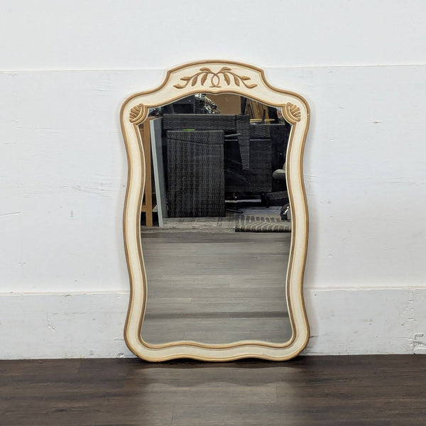 Ornate Drexel Heritage mirror with delicate curves and original hardware, shown standing against a wall.