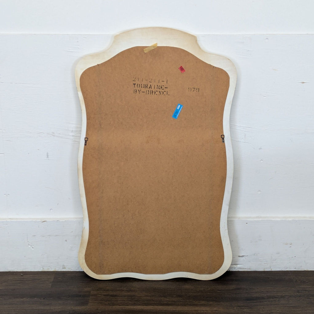 Back view of the Drexel Heritage mirror, displaying the original hardware and brand markings on the wood.