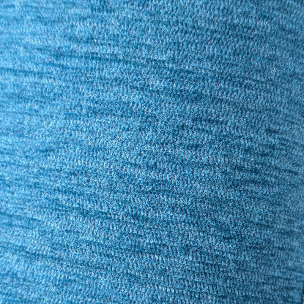 3. Close-up of Room & Board bed frame blue fabric upholstery, showing detailed texture.