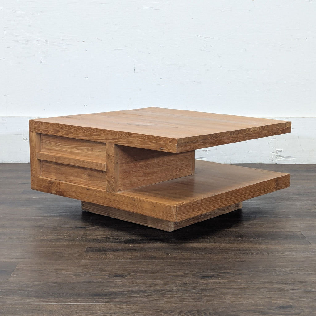 2. Contemporary square coffee table by Reperch, featuring two thick wood surfaces and a central divider.