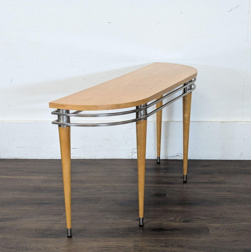 3. Side view of an Ethan Allen side & console table showing the curved wood top and metal accents on tapered legs.