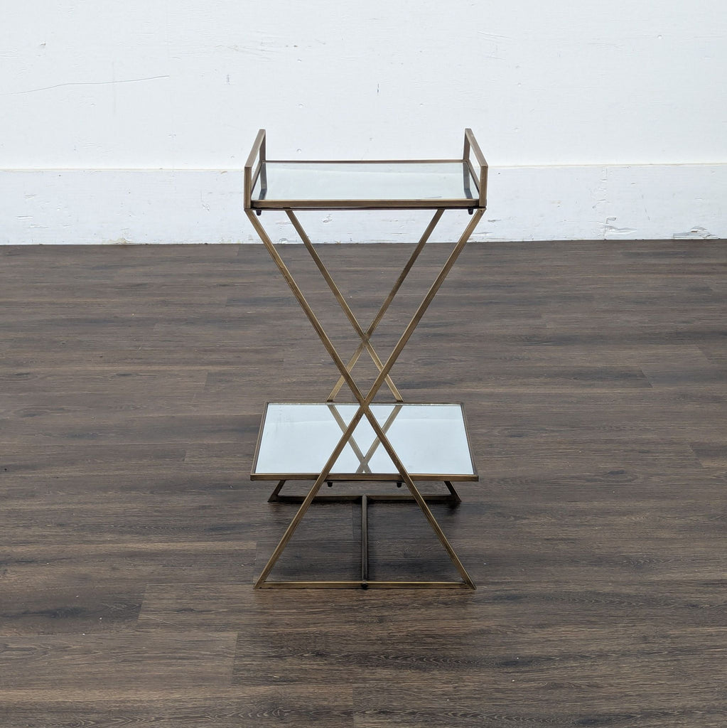 3. Reperch brand side and console table with glass shelves, gold frame, against a wooden floor background.