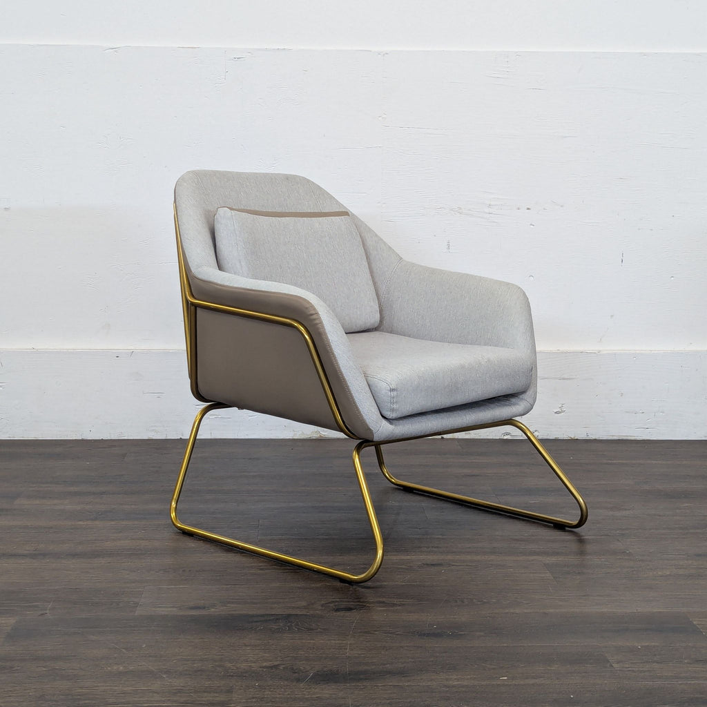 3. Sleek Reperch lounge chair in light grey with gold legs, angled view showcasing its minimalist lounge design.