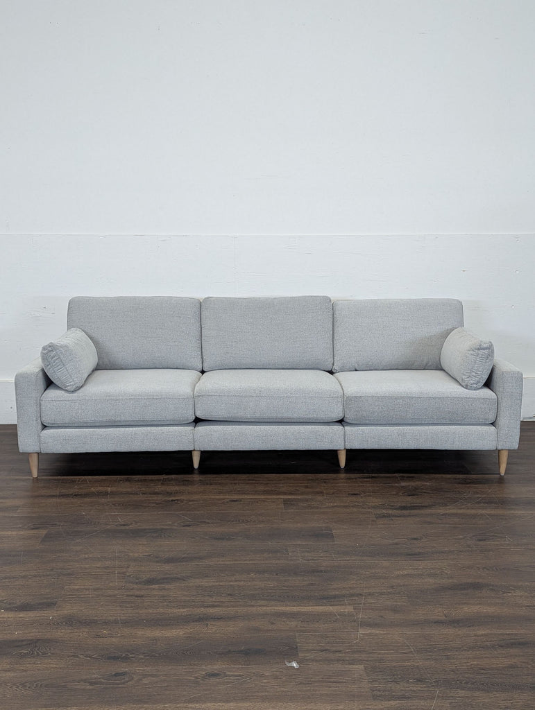 Modern sofa by Burrow featuring wood feet and soft, crushed gravel chenille upholstery.