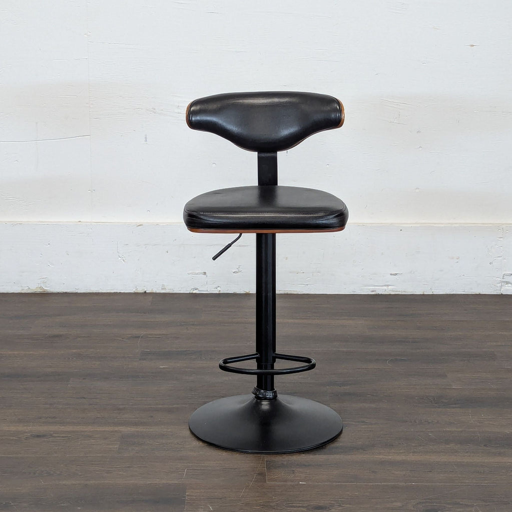 2. Black swivel stool by Ashley Furniture, featuring cushioned seat, curved back, and sturdy pedestal base.