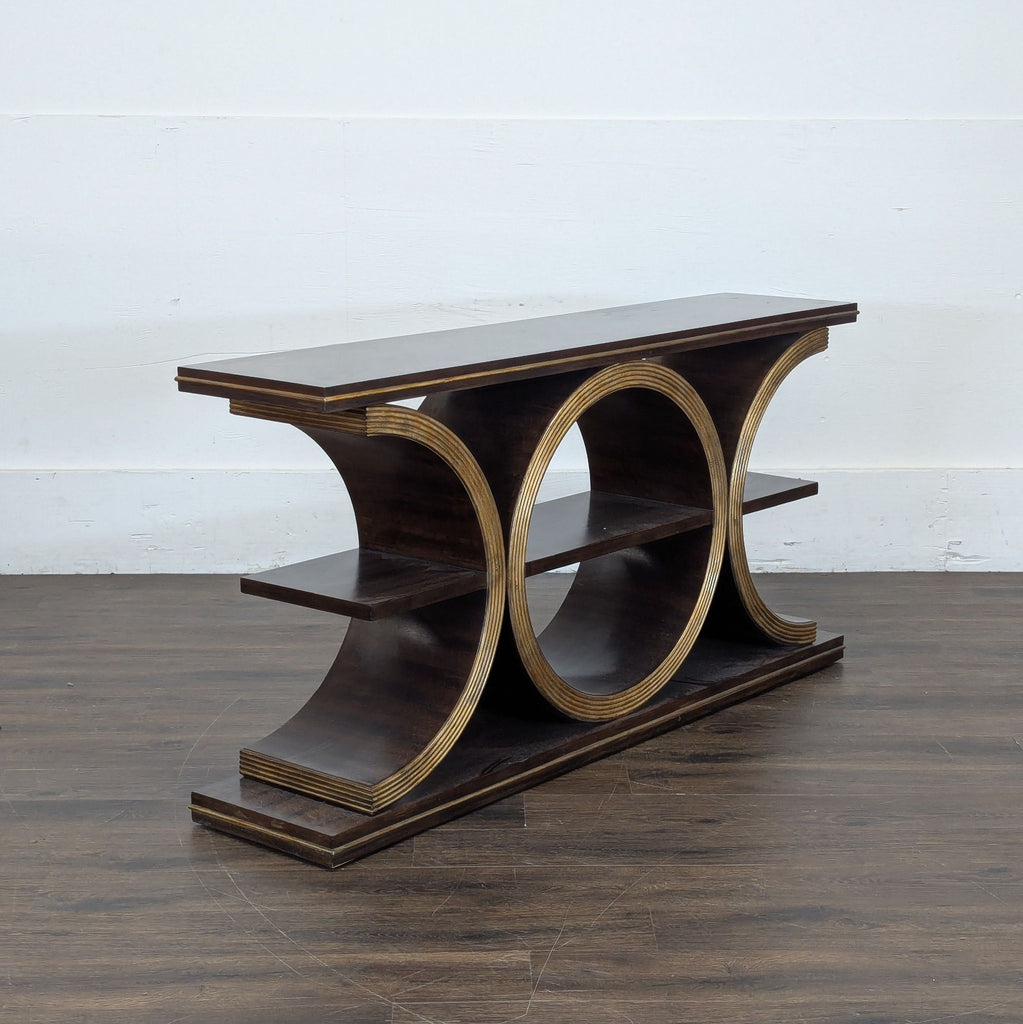 3. Sculptural console table with circular cutouts and two levels, designed for stylish side or entryway use.