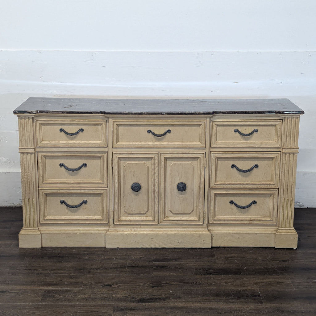 2. Vintage Stanley dresser with six drawers, three smaller top drawers, and two central doors, marble surface.