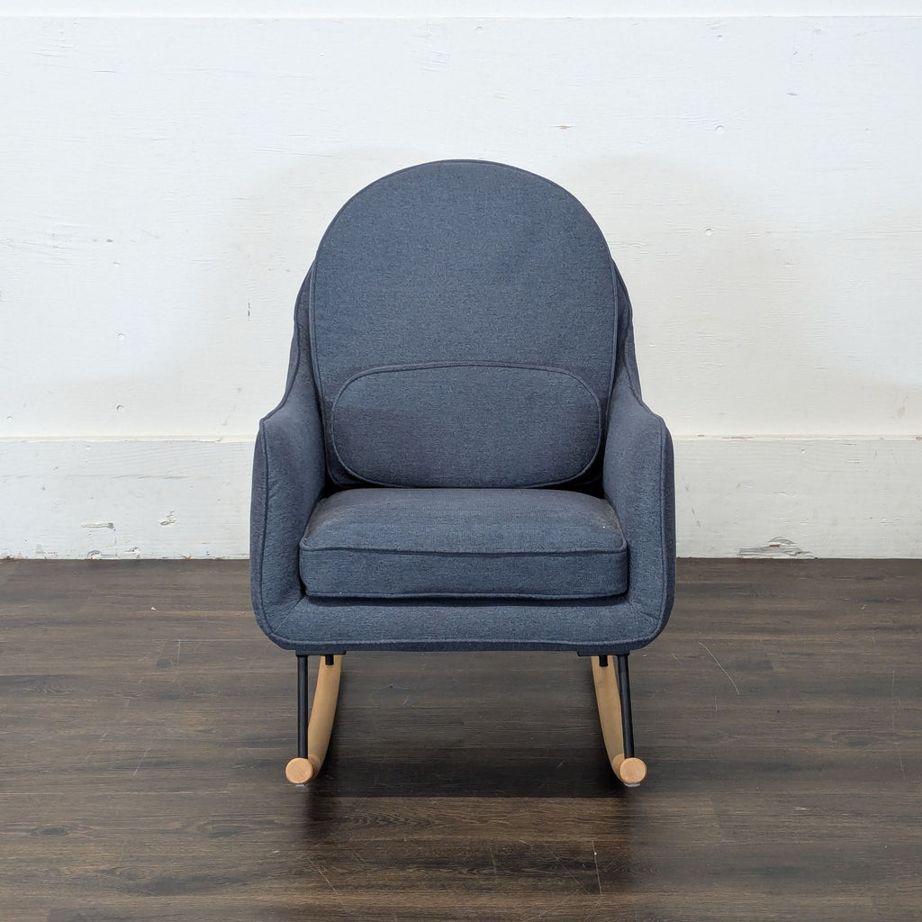 Unused Delta Children rocking chair, perfect for nursery or new mothers.