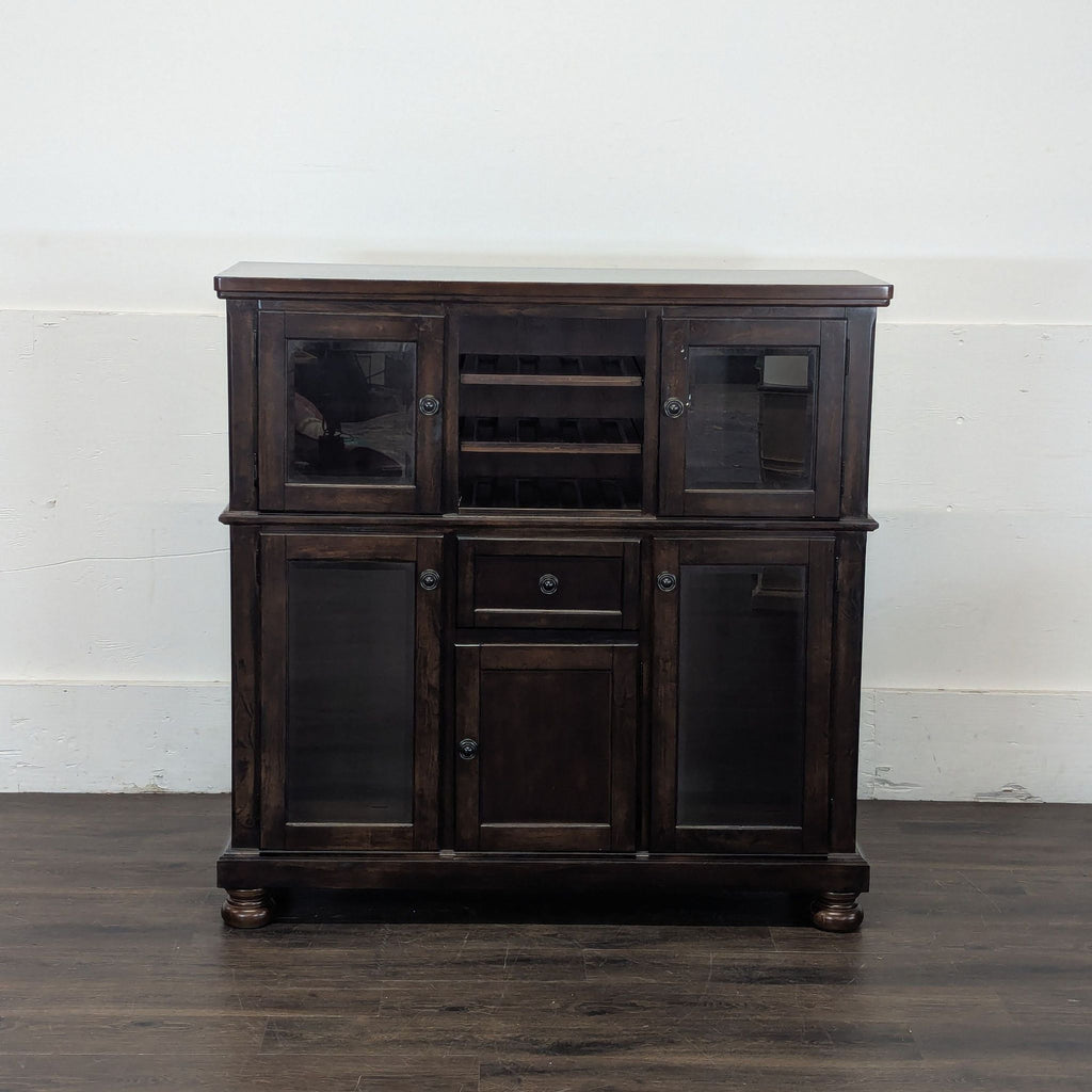 2. Ashley Furniture Porter Dining Server cabinet features rich wood finish and ample space for dining essentials.