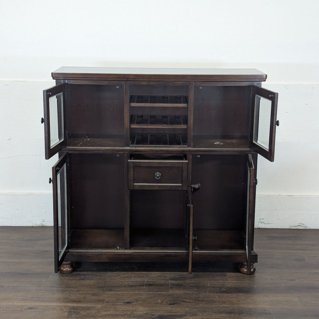 3. Elegant dark wood Porter Dining Server by Ashley Furniture, a cabinet ideal for storing dishes and utensils.