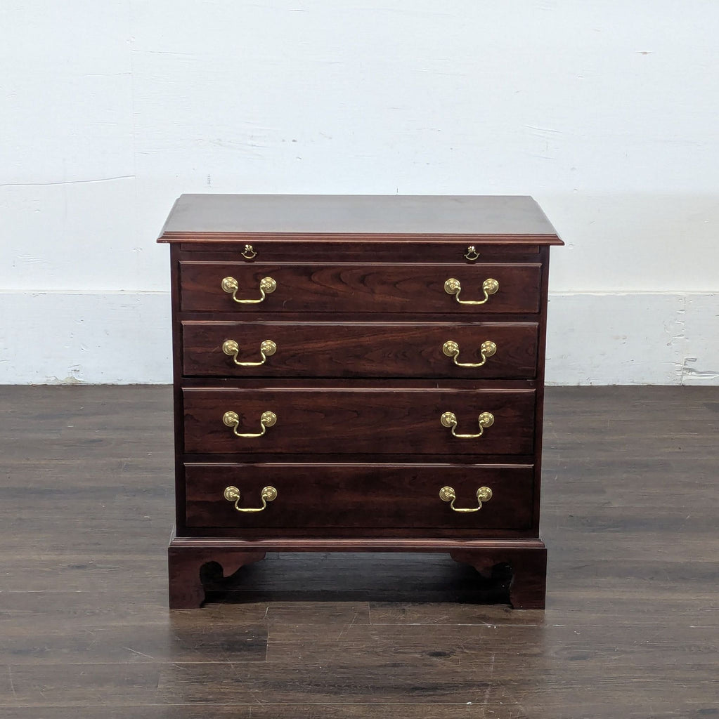 2. Classic Stickley dark wood end table featuring four drawers with brass pulls, displayed on wooden flooring.