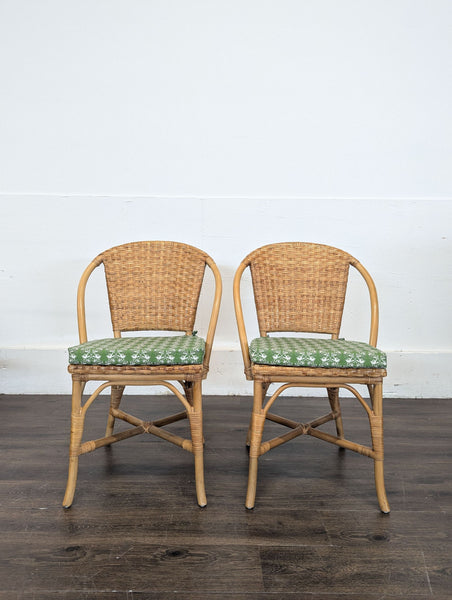 Pottery Barn dining chair featuring rattan and bamboo design, natural finish, and seat cushion.  
