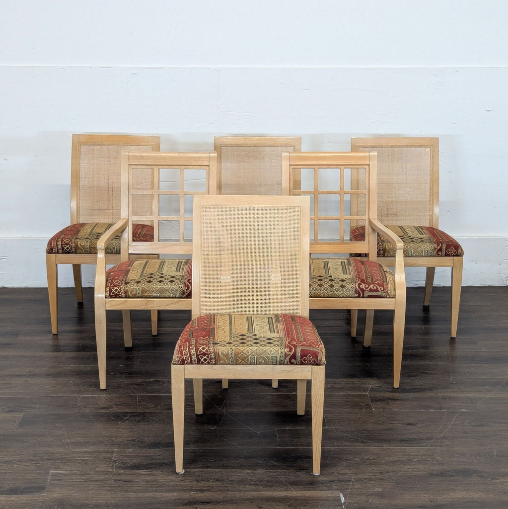 1. Set of dining chairs with natural wood frames, cane backs, and patterned upholstered seats arranged in rows.