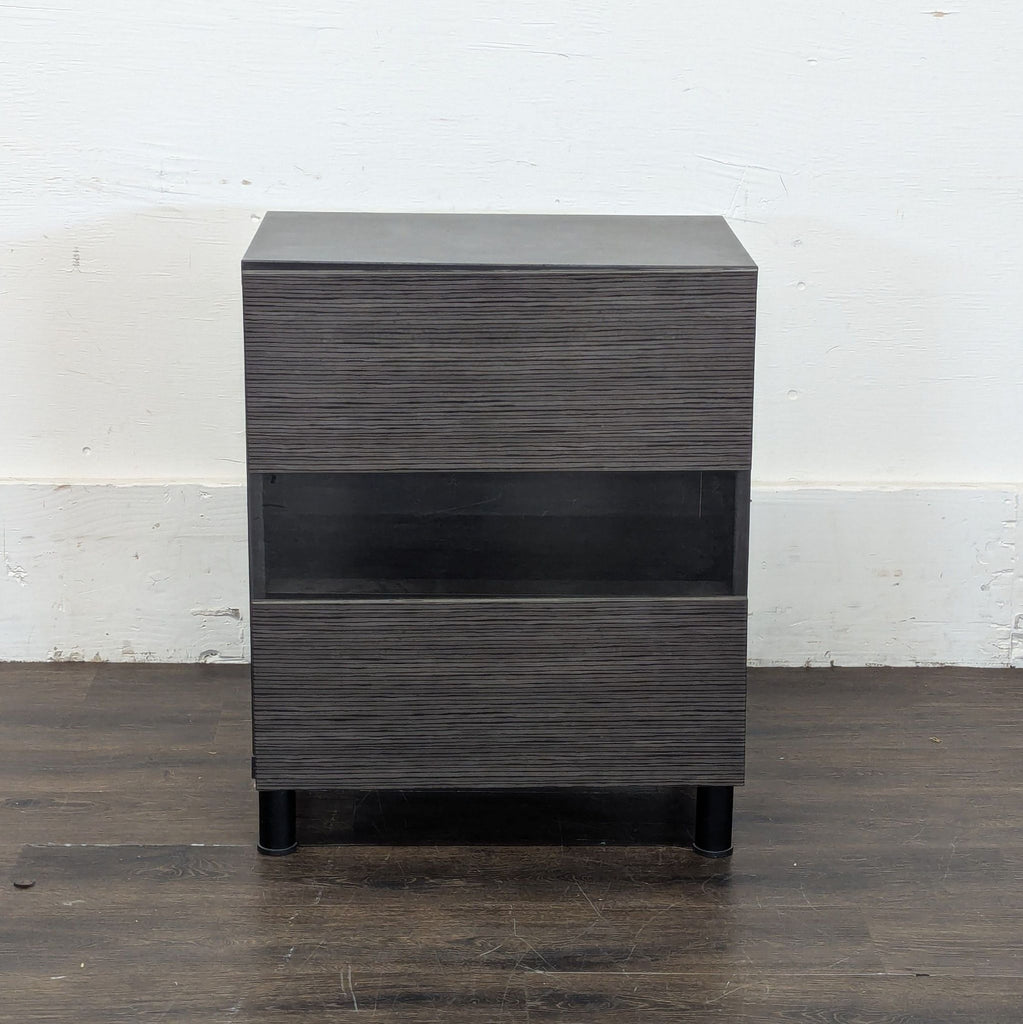 2. Modern dark wood end table with two drawers and open shelf, standing against a white wall.