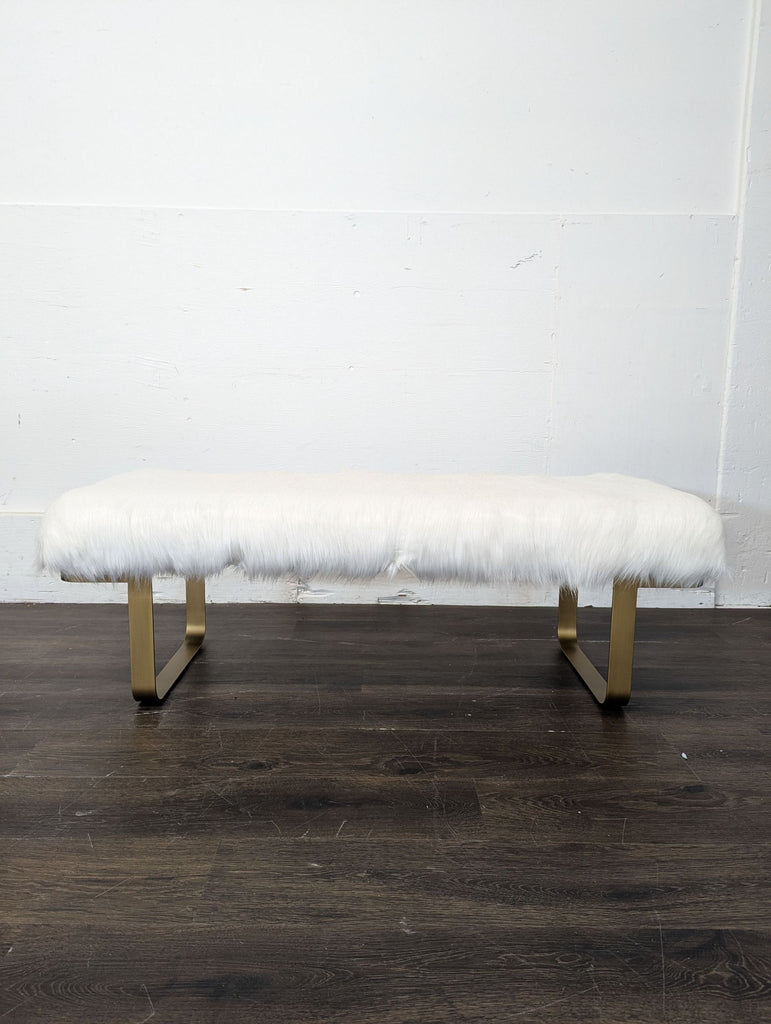 Faux fur bench with gold-toned sled legs, from Restoration Hardware, in the Stools, Ottomans & Benches category.  