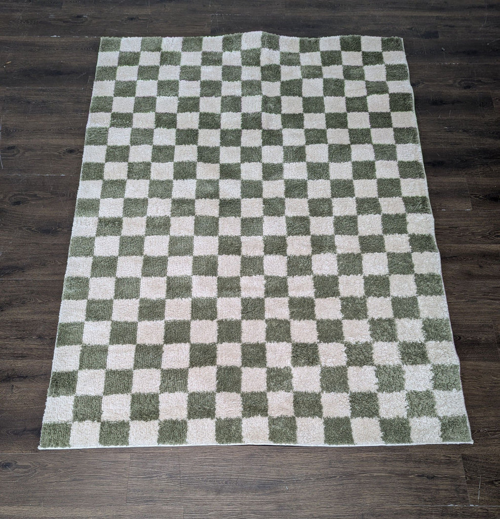 Checkerboard rug from Livabliss, Fossay model, measuring 5'2" x 7', perfect for stylish interiors.  