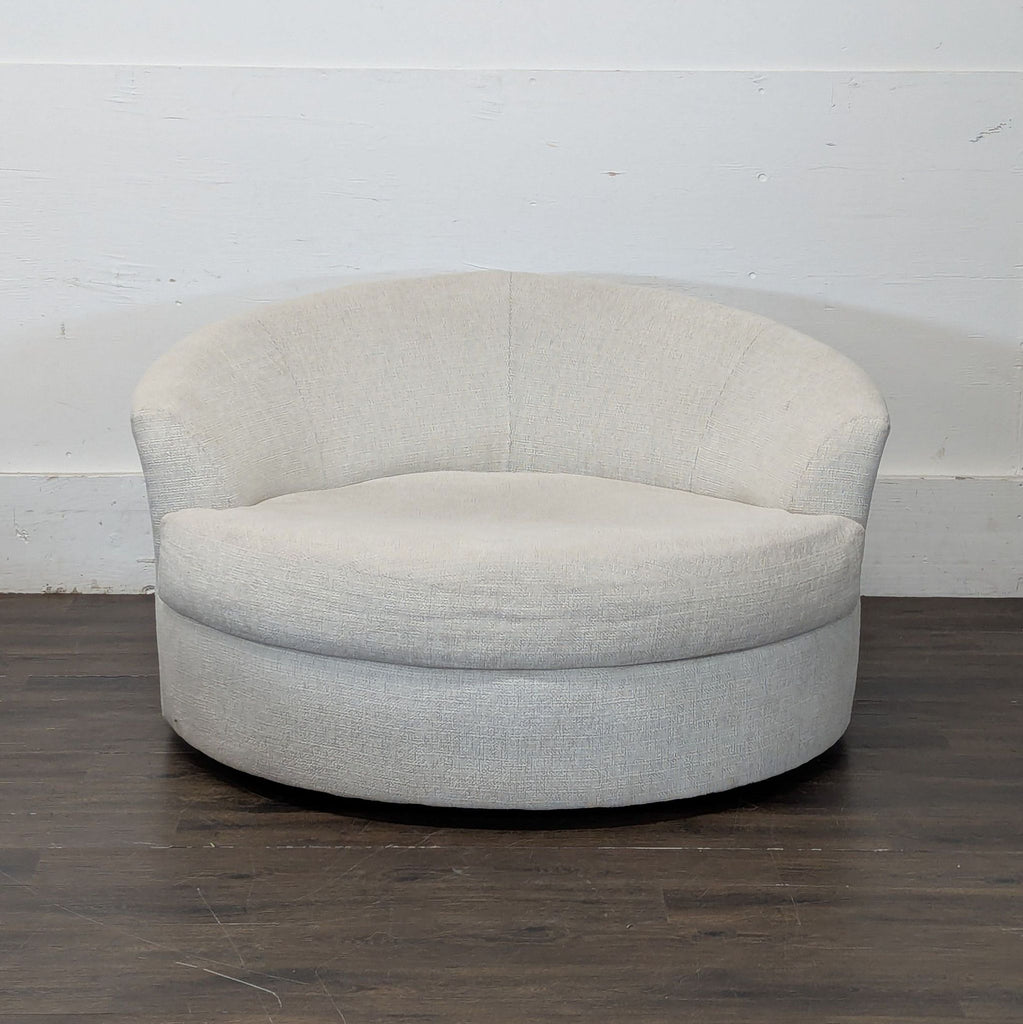 2. Plush, round swivel chair in cream boucle fabric, ideal for cozy seating; categorized under stools and benches.  