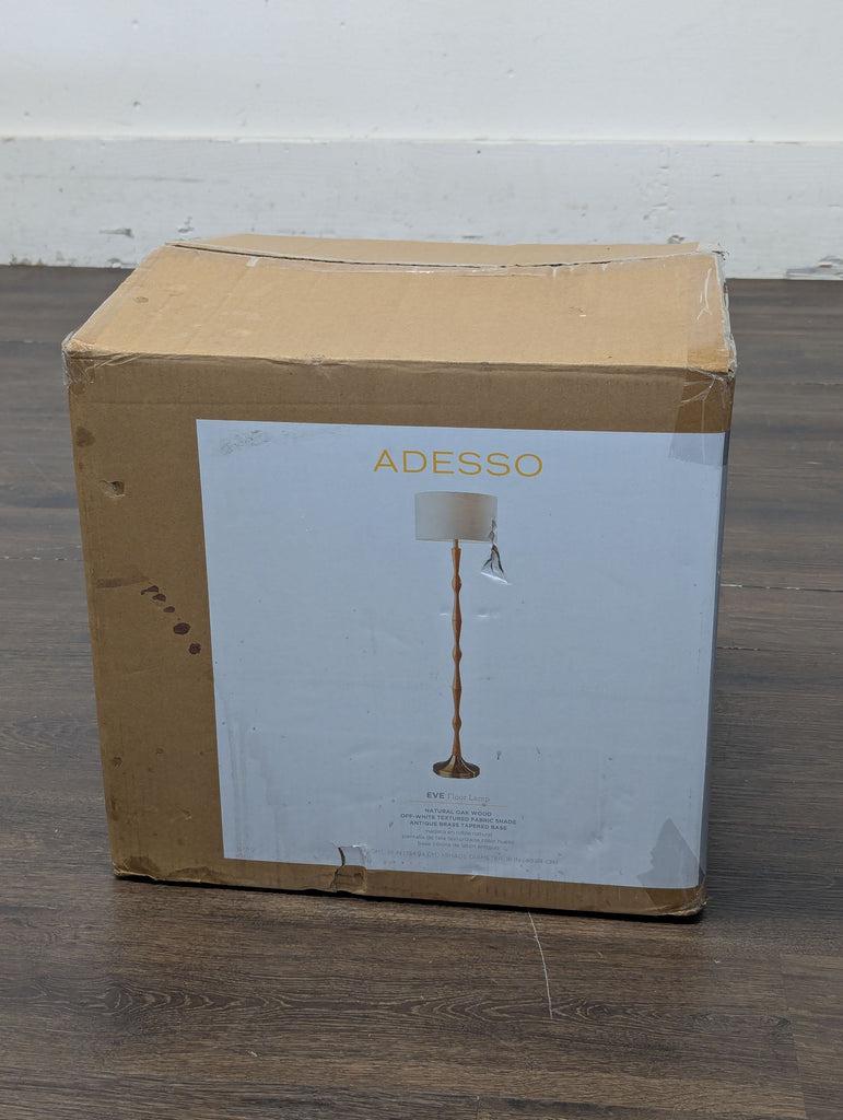3. Contemporary Lighting category lamp by Adesso, showcasing a tall stand and directional light fixtures.