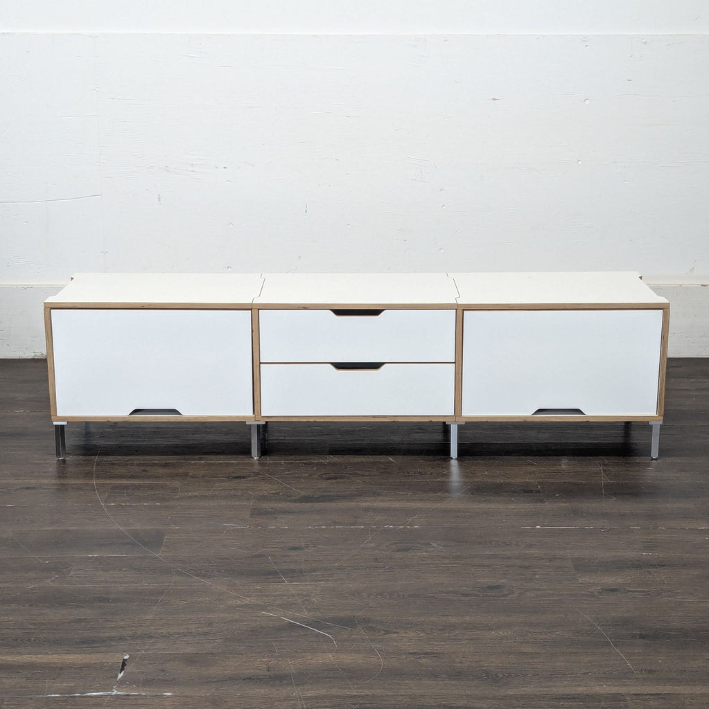 Sleek wood cabinet from Scandinavian design brand, featuring spacious storage and simple elegance.  