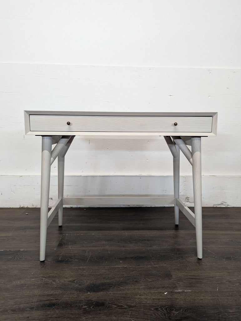 2. Compact office desk with built-in storage shelves, ideal for small home workspaces.  