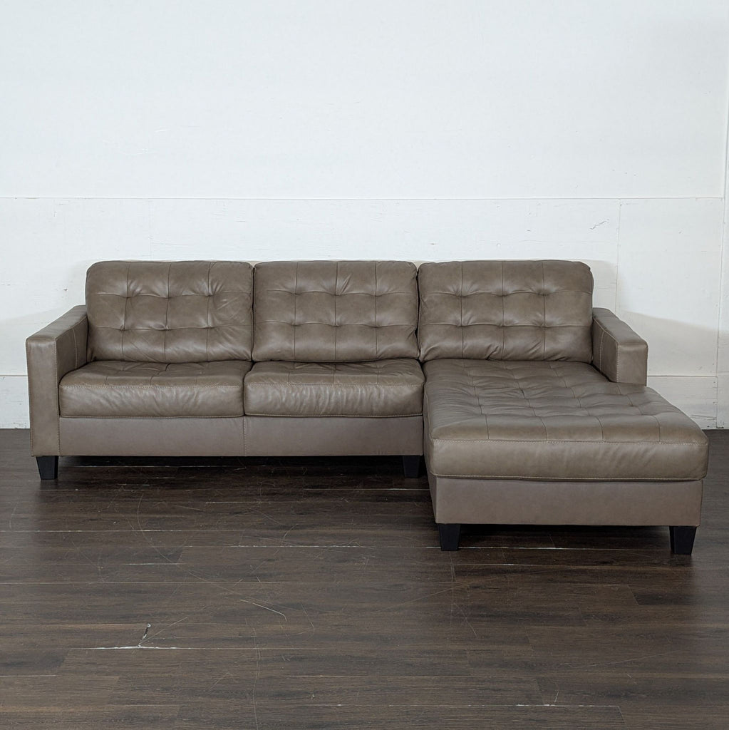 Modern brown leather sectional, lightly used, perfect for living room seating.  