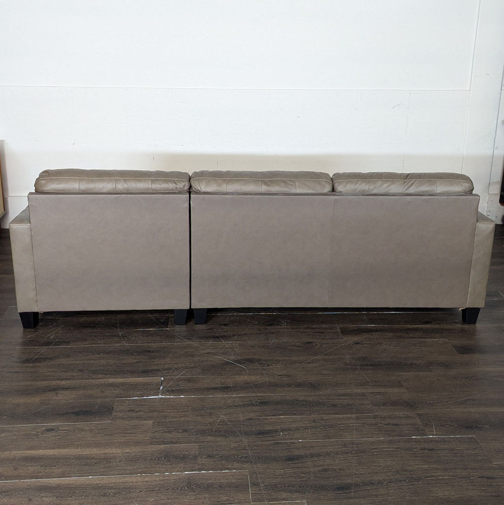 Brown leather sectional, a year old