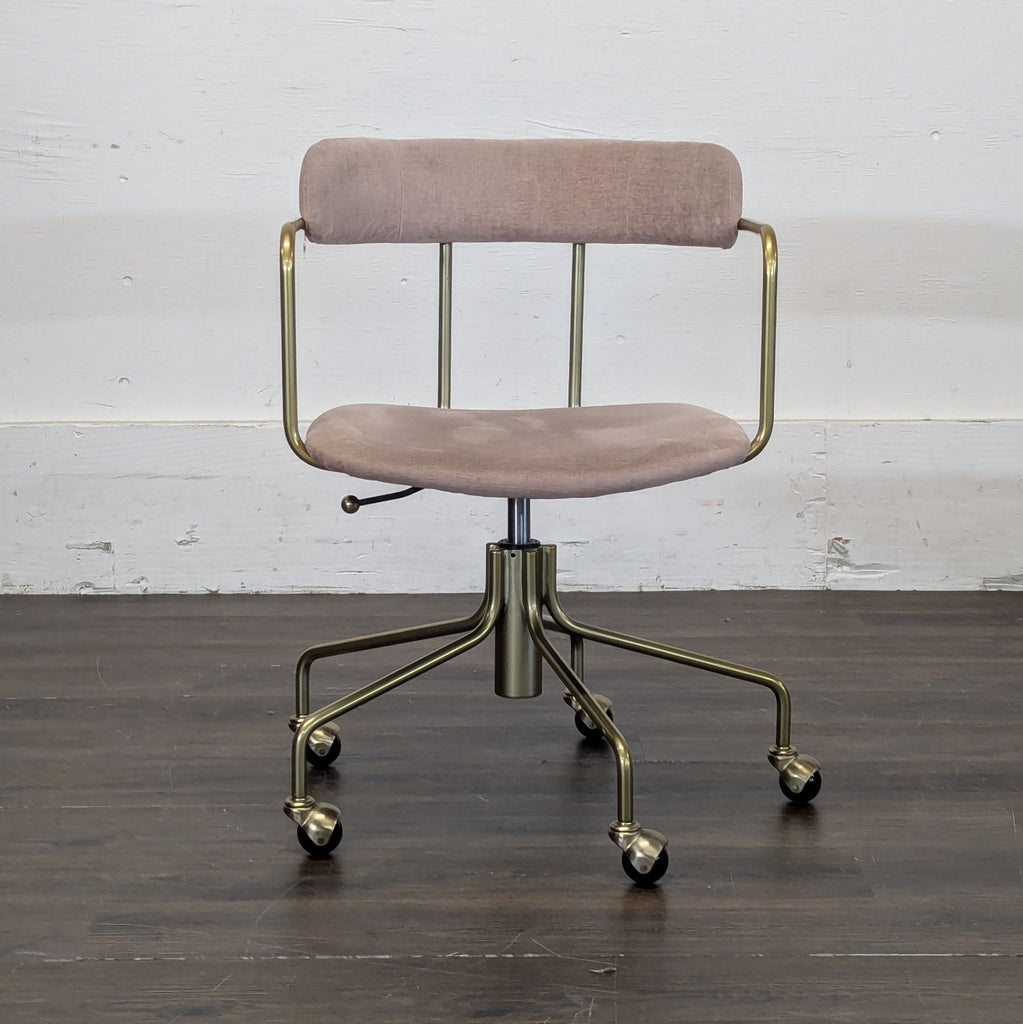 1. Modern West Elm accent chair with wooden legs and upholstered seat in navy blue fabric.
