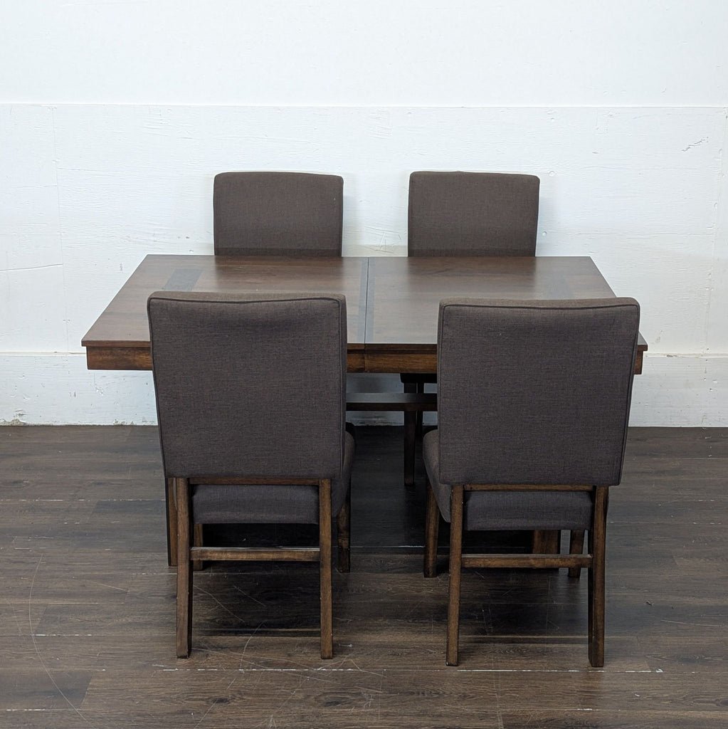 2. Modern Dining Set by Norcal Furnitures includes a sturdy rectangular table and four cushioned chairs.