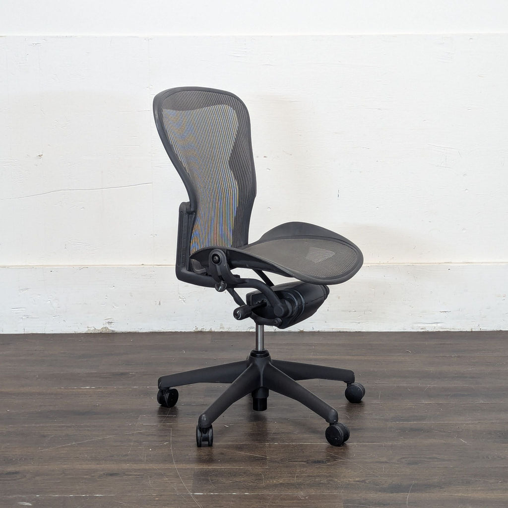 Set of two Herman Miller Aeron chairs, both operational and well-maintained, included in the listing.