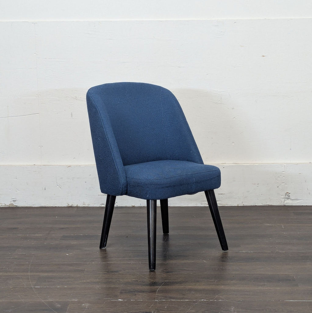 2. Contemporary dining chair from Room and Board, featuring clean lines and a minimalist upholstered design.