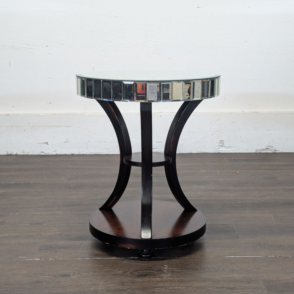 3. Stylish Z Gallerie end table with glass top, mirror trim, and curved black supports over a wooden base.