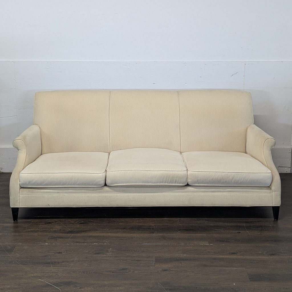 2. Restoration Hardware 3-seat beige sofa with plush cushions and curved arms, shown against a white wall.