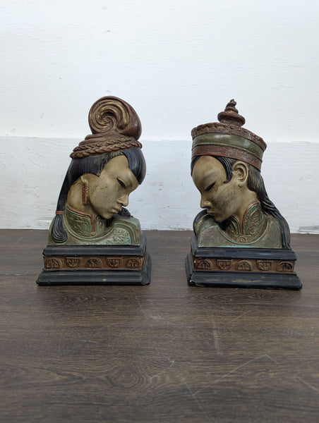 1. Pair of vintage bust bookends on a wooden surface, featuring intricate detailing and traditional attire.