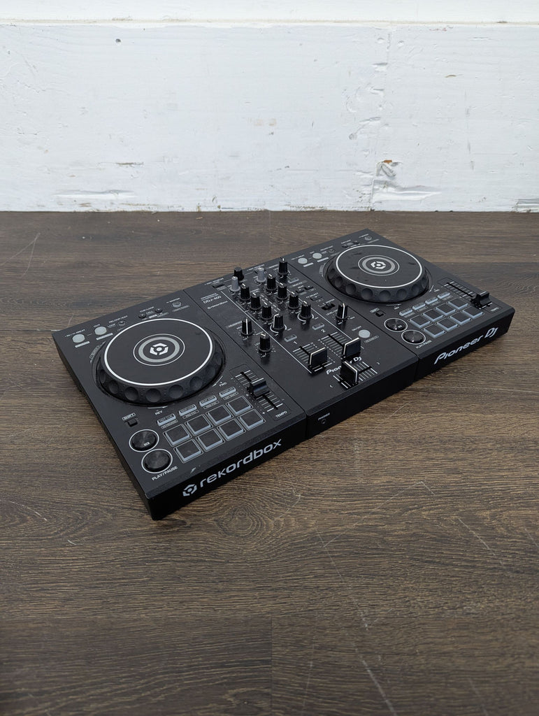 Pioneer DJ DDJ-400 audio gear, good condition, featuring a compact design and labeled inputs for DJs.