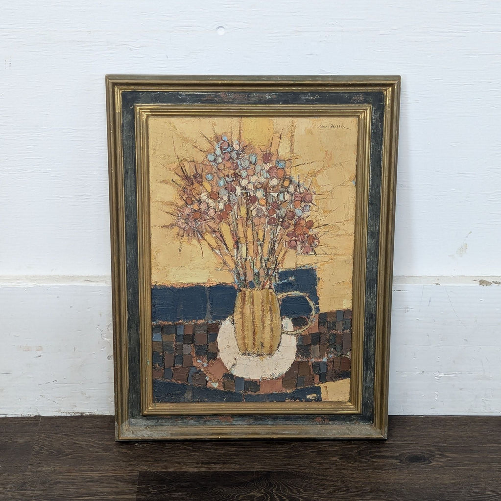 2. Framed abstract painting depicting a floral arrangement in a yellow vase, displayed against a white wall.