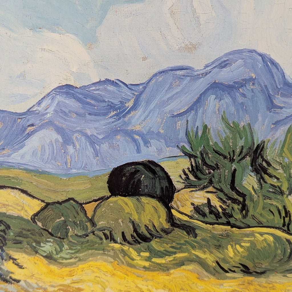 3. Close-up of a print showing textured brushstrokes of green fields and blue-purple mountains.