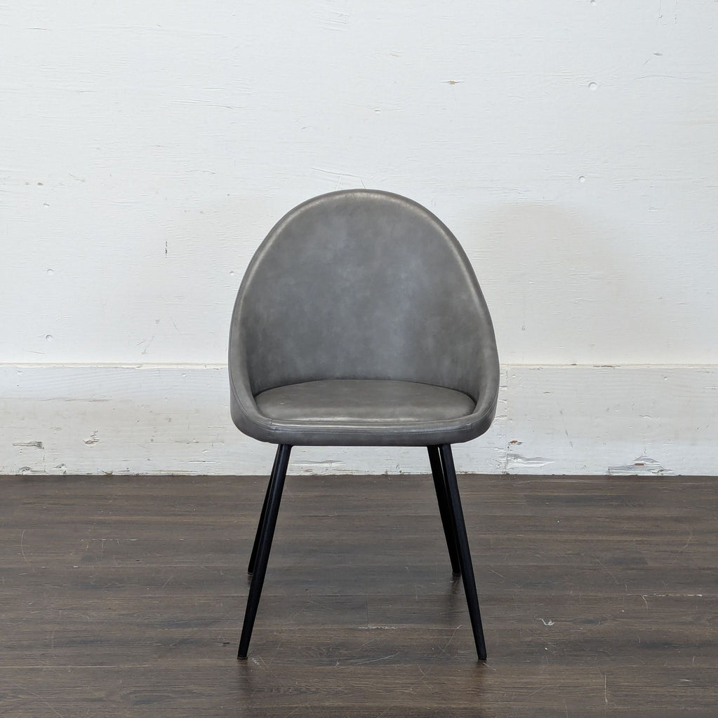 1. Modern dining chair with a minimalistic design from an unknown brand, ideal for contemporary dining spaces.