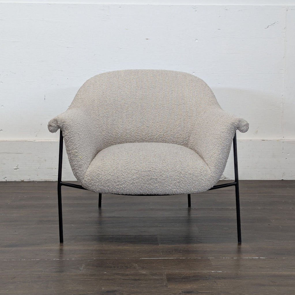 Modern lounge chair by Four Hands featuring a sleek, minimalist design and plush cushioning.  