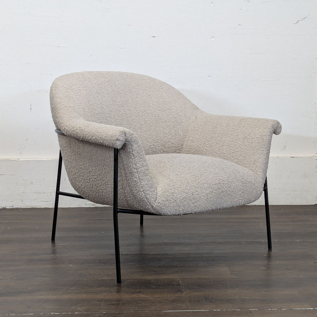 Elegant Four Hands lounge seat with contemporary styling, perfect for relaxing in any room.  
