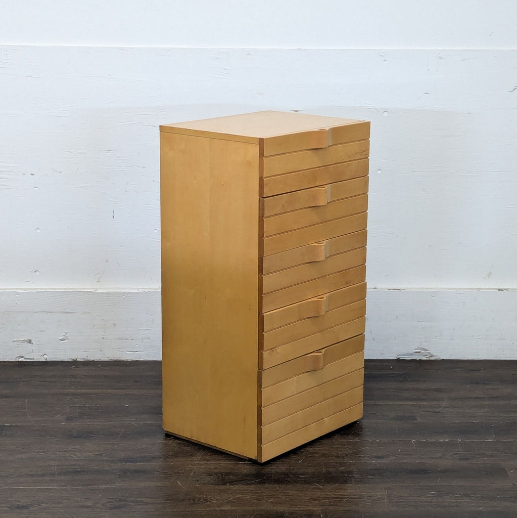 3. Four-drawer dresser in Scandinavian style, accentuating simplicity and functionality with a smooth wooden texture.