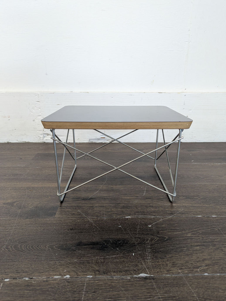 1. Wooden entertainment center with a built-in foldable end table, designed for versatile living spaces.