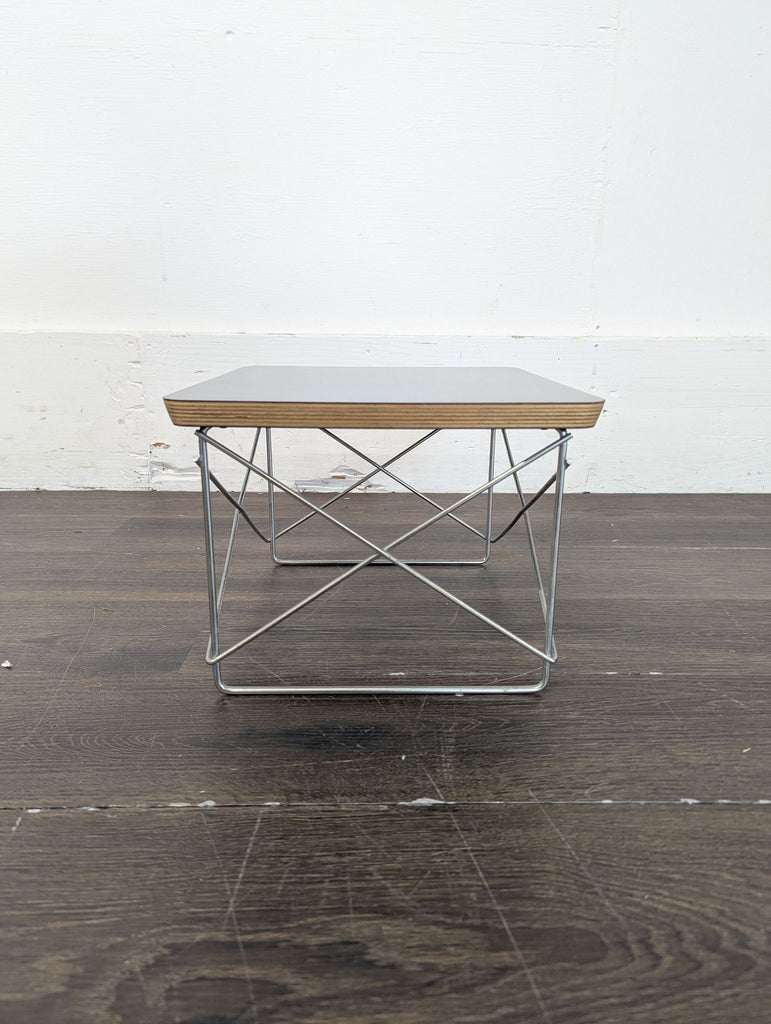 3. Multi-functional wooden ottoman featuring storage space and an attached collapsible end table.